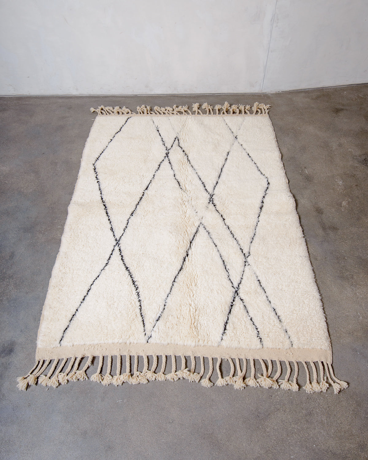 Modern, designer, handcrafted Berber rug from Morocco. Beniourain carpet with minimalist design, natural wool pile and a fluffy texture.